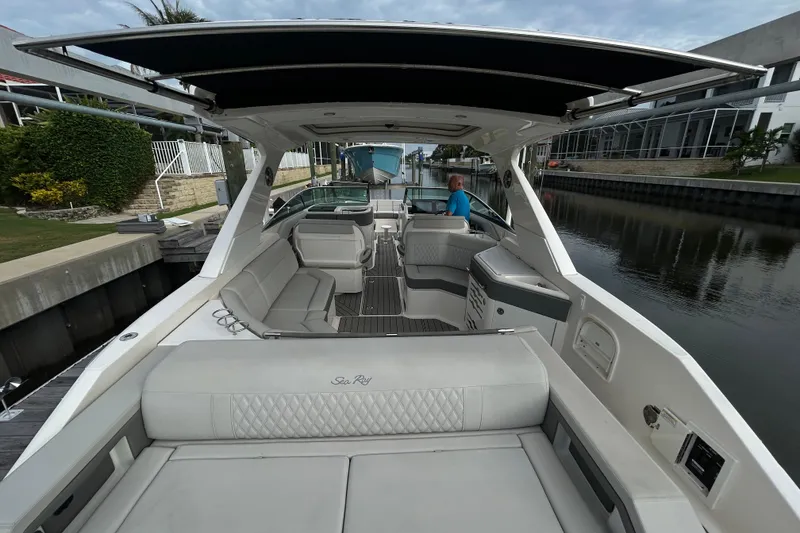 Slide: The Image of 2024 Sea Ray SLX 310 Outboard luxury boat interior with spacious seating and sleek design. - 142