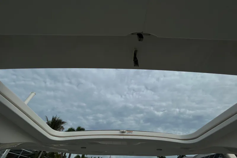 Slide: The Image of 2024 Sea Ray SLX 310 Outboard boat roof view under cloudy sky. - 144