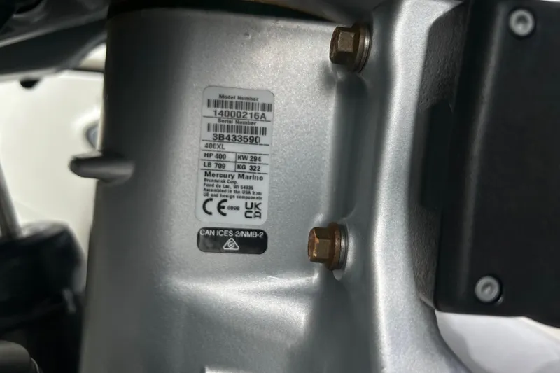 Slide: The Image of Close-up of Mercury Marine engine label on 2024 Sea Ray SLX 310 Outboard. - 149