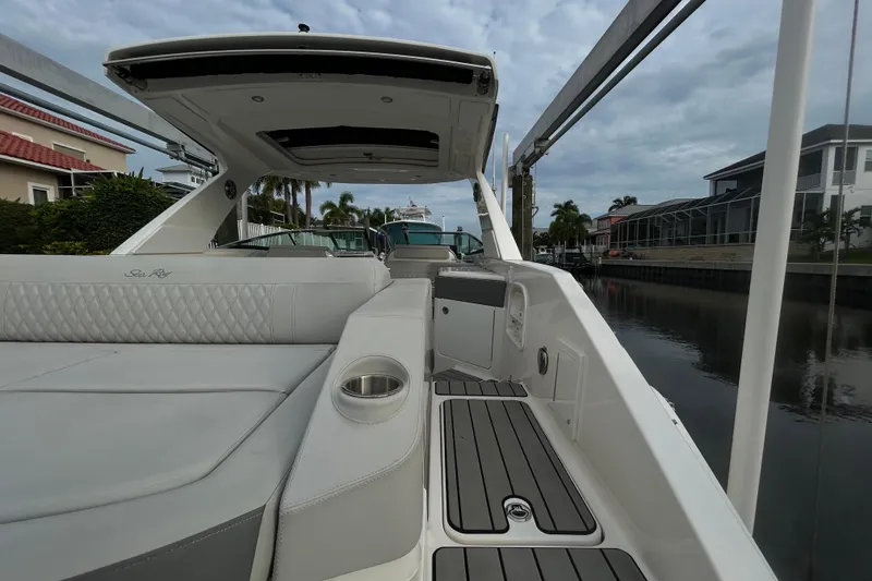 Slide: The Image of 2024 Sea Ray SLX 310 Outboard luxury boat interior with sleek seating and modern design. - 15