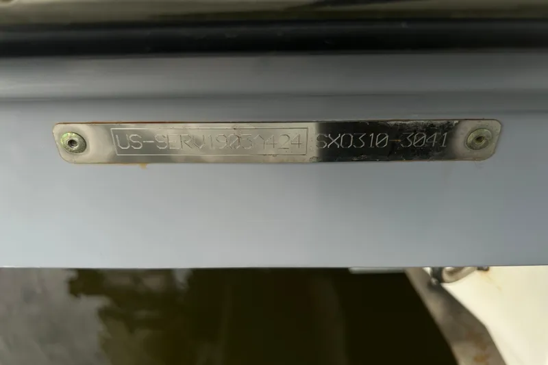 Slide: The Image of 2024 Sea Ray SLX 310 Outboard identification plate with serial number. - 150