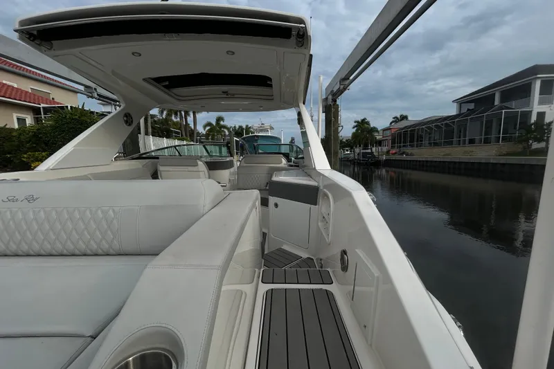Slide: The Image of 2024 Sea Ray SLX 310 Outboard luxury boat interior with sleek seating and modern design. - 16