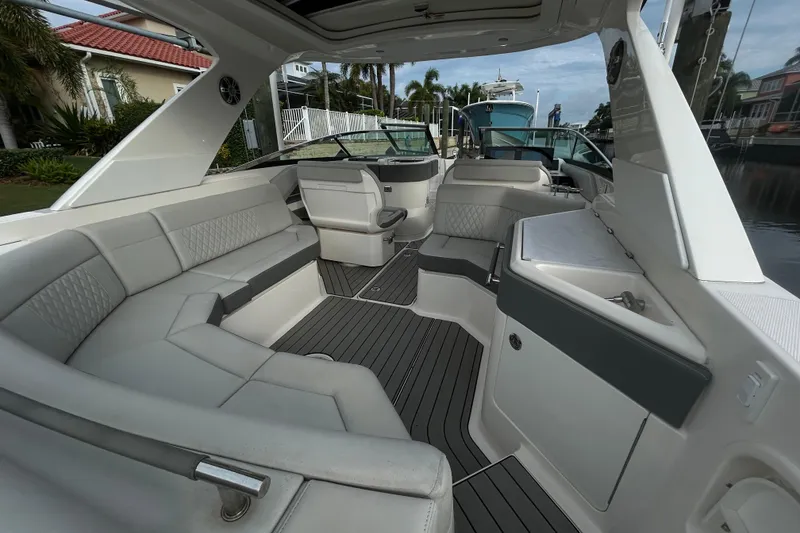 Slide: The Image of Luxurious interior of 2024 Sea Ray SLX 310 Outboard boat with spacious seating. - 25