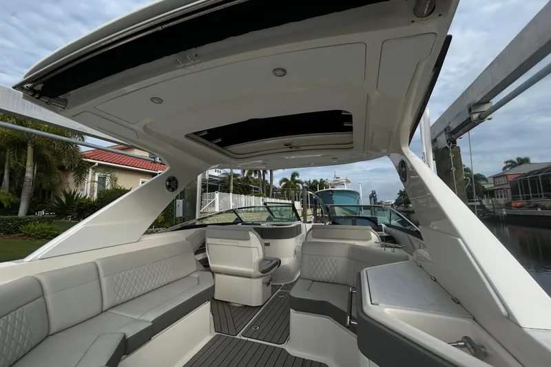 Slide: The Image of 2024 Sea Ray SLX 310 Outboard boat interior with luxurious seating and sleek design. - 26