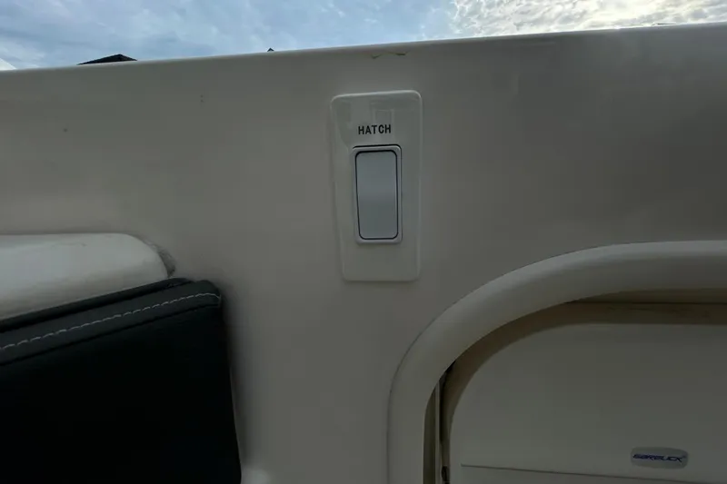 Slide: The Image of Hatch switch on 2024 Sea Ray SLX 310 Outboard boat interior. - 30