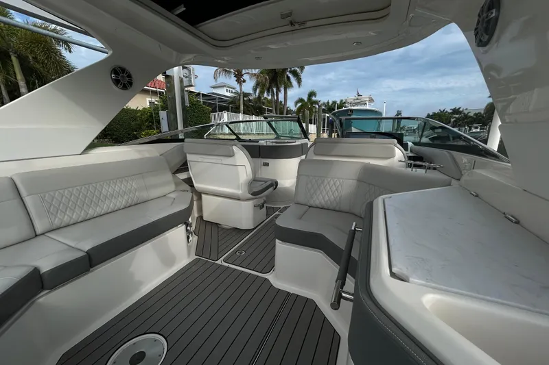 Slide: The Image of Luxurious interior of 2024 Sea Ray SLX 310 Outboard boat with elegant seating and modern design. - 32