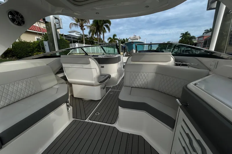 Slide: The Image of Luxurious interior of 2024 Sea Ray SLX 310 Outboard boat with plush seating and sleek design. - 33