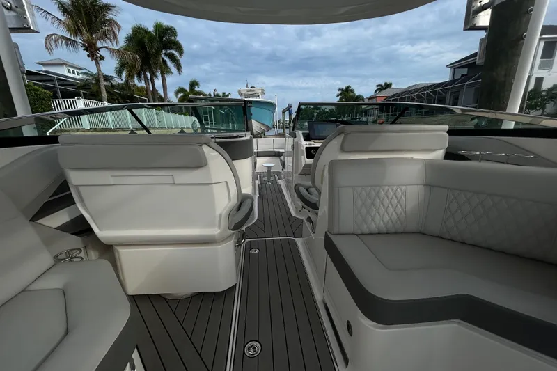 Slide: The Image of 2024 Sea Ray SLX 310 Outboard interior with luxurious seating and modern design. - 34