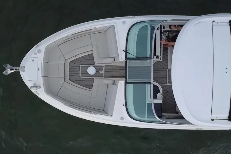Slide: The Image of Top view of 2024 Sea Ray SLX 310 Outboard boat, showcasing spacious seating and sleek design. - 14