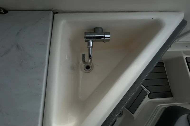 Slide: The Image of 2024 Sea Ray SLX 310 Outboard boat sink with chrome faucet. - 40