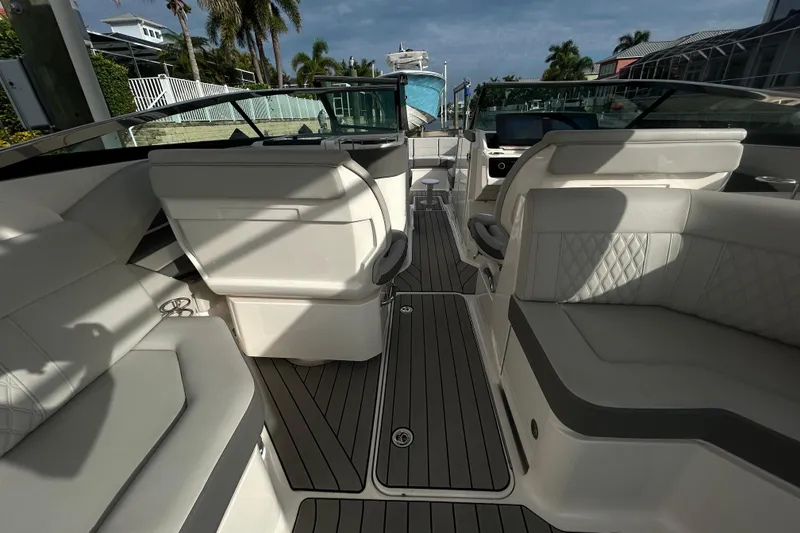 Slide: The Image of 2024 Sea Ray SLX 310 Outboard interior with luxurious seating and modern design. - 49