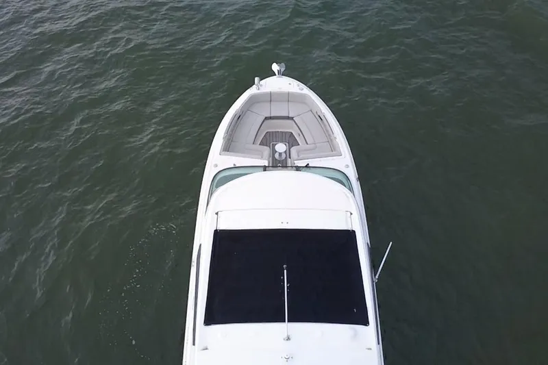 Slide: The Image of Top view of 2024 Sea Ray SLX 310 Outboard boat on water. - 12