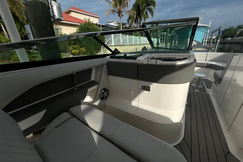 Slide: The Image of 2024 Sea Ray SLX 310 Outboard interior with sleek seating and modern design. - 53