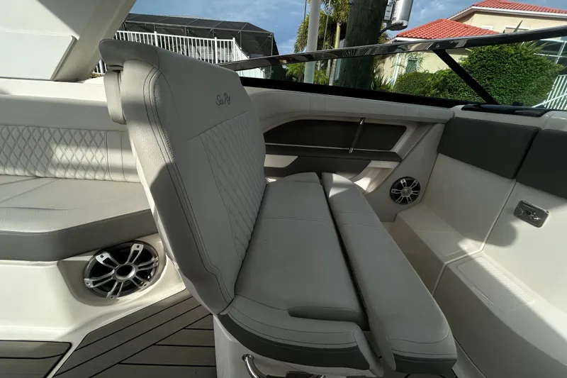 Slide: The Image of 2024 Sea Ray SLX 310 Outboard interior with luxurious seating and modern design. - 54