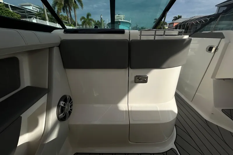 Slide: The Image of 2024 Sea Ray SLX 310 Outboard interior with sleek seating and modern design elements. - 55