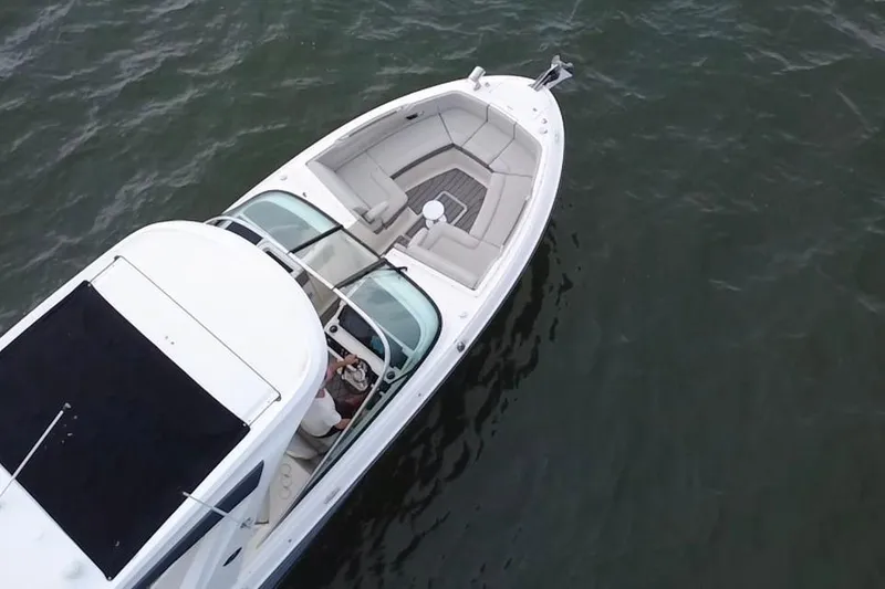 Slide: The Image of Aerial view of 2024 Sea Ray SLX 310 Outboard boat on water. - 11