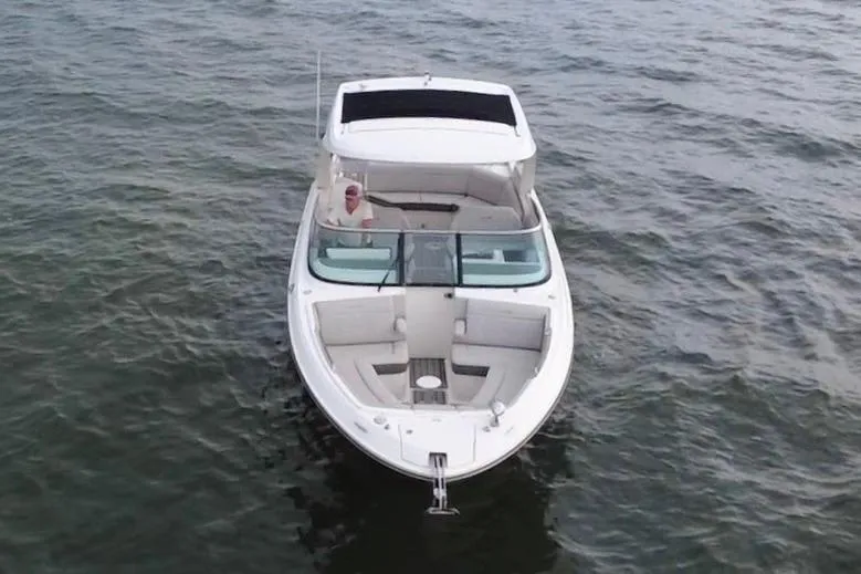 Slide: The Image of 2024 Sea Ray SLX 310 Outboard boat on open water, aerial view. - 9