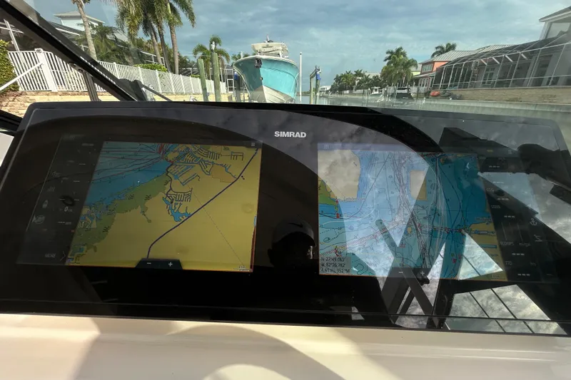 Slide: The Image of Navigation display on 2024 Sea Ray SLX 310 Outboard, showing detailed marine charts. - 74