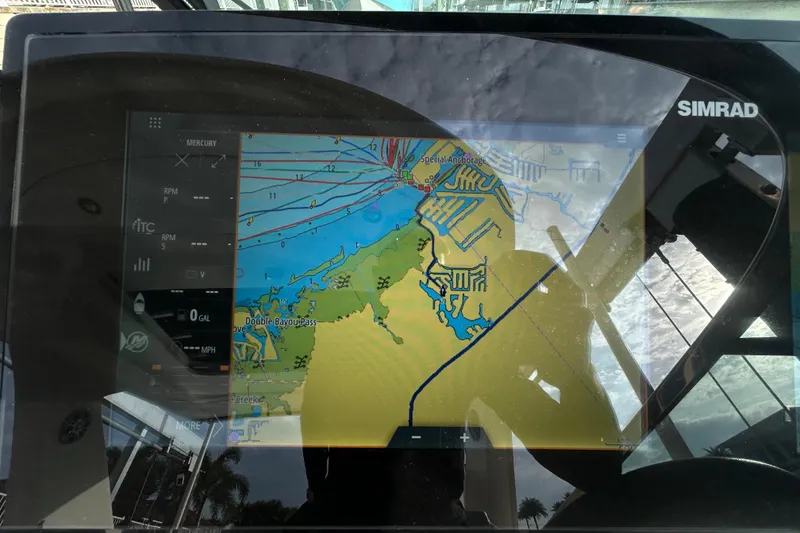 Slide: The Image of Simrad navigation display on 2024 Sea Ray SLX 310 Outboard, showing detailed marine map. - 75