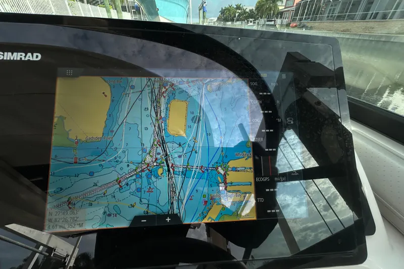 Slide: The Image of Simrad navigation display on 2024 Sea Ray SLX 310 Outboard boat. - 76