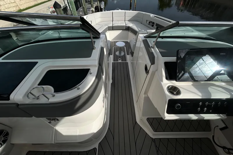 Slide: The Image of 2024 Sea Ray SLX 310 Outboard interior with sleek design and modern controls. - 80