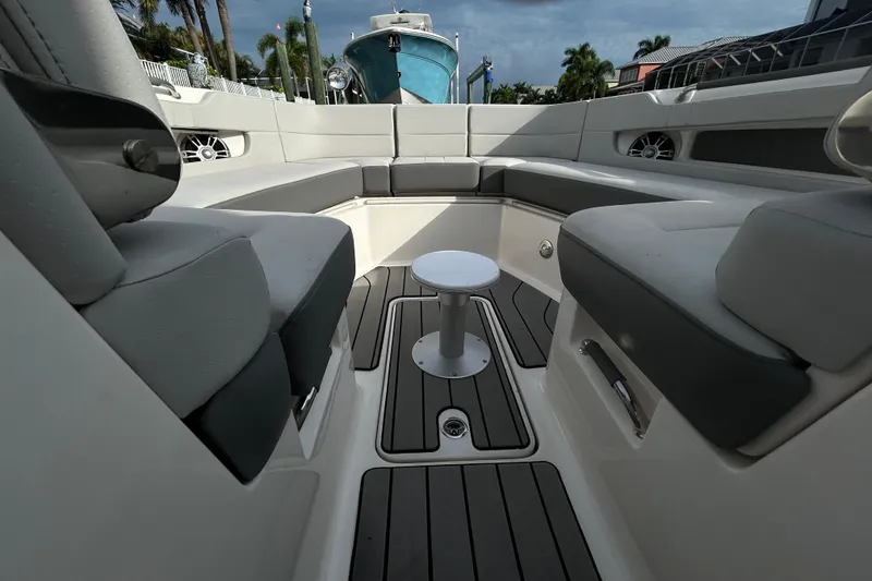 Slide: The Image of 2024 Sea Ray SLX 310 Outboard interior with spacious seating and sleek design. - 88