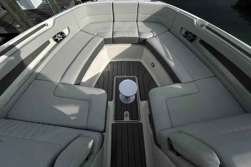 Slide: The Image of 2024 Sea Ray SLX 310 Outboard boat interior with luxurious seating and sleek design. - 89