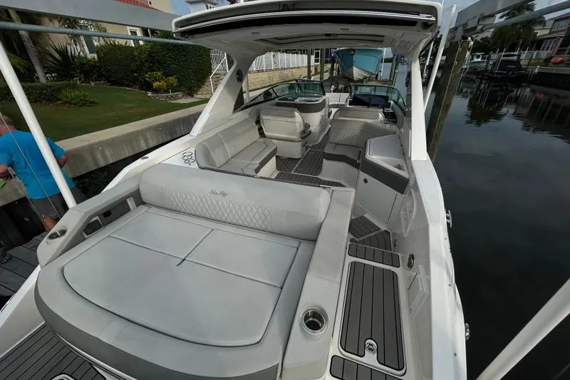 Slide: The Image of 2024 Sea Ray SLX 310 Outboard boat interior with luxurious seating and sleek design. - 9
