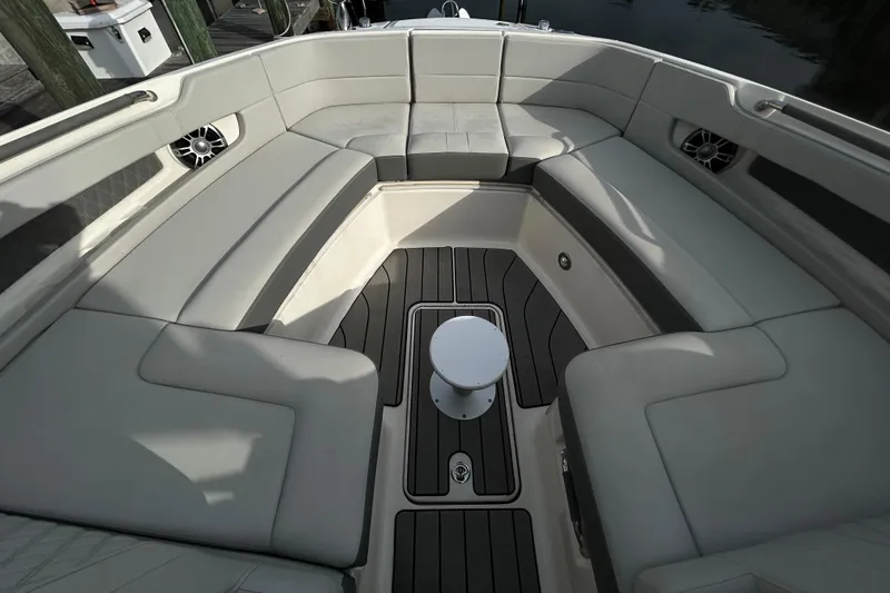 Slide: The Image of Luxurious seating area on 2024 Sea Ray SLX 310 Outboard boat, featuring sleek design and comfort. - 93