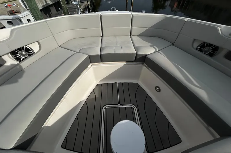 Slide: The Image of 2024 Sea Ray SLX 310 Outboard boat interior with spacious seating and modern design. - 94