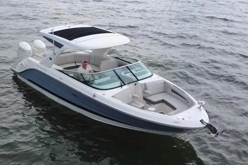 Slide: The Image of 2024 Sea Ray SLX 310 Outboard cruising on open water, showcasing sleek design and luxury features. - 8