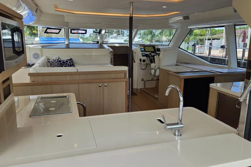 Slide: The Image of Luxurious interior of a 2020 Aquila 44 Yacht featuring modern kitchen and helm. - 10