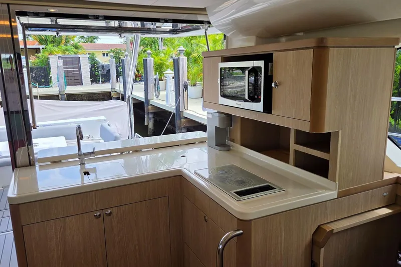 Slide: The Image of Modern kitchen interior of 2020 Aquila 44 Yacht with microwave and sleek cabinetry. - 11