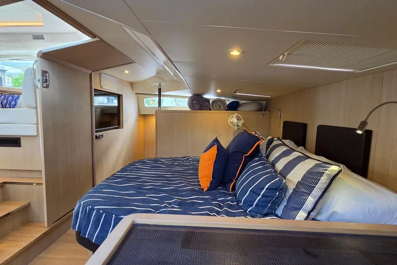 Slide: The Image of Luxurious interior cabin of 2020 Aquila 44 Yacht with cozy bedding and modern design. - 15