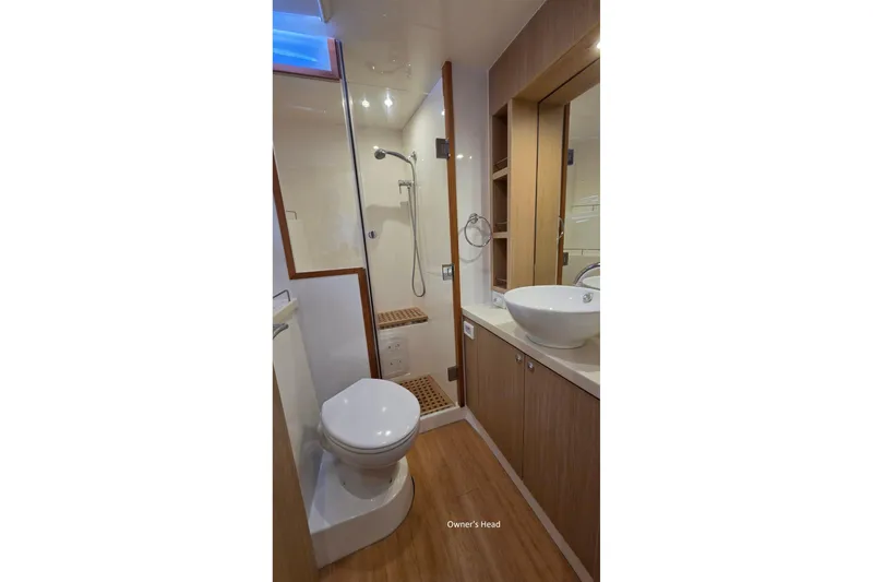 Slide: The Image of Luxurious bathroom in 2020 Aquila 44 Yacht with modern fixtures and wooden accents. - 17