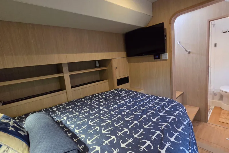 Slide: The Image of Cozy bedroom in 2020 Aquila 44 Yacht with nautical-themed bedding and modern amenities. - 23
