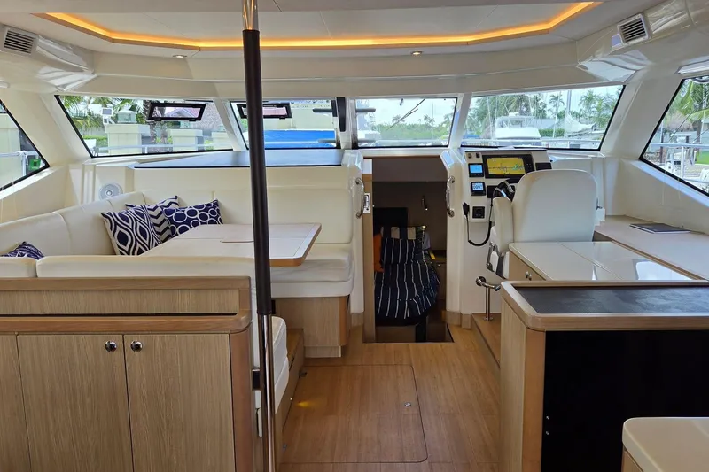 Slide: The Image of Luxurious interior of 2020 Aquila 44 Yacht with modern seating and navigation area. - 26