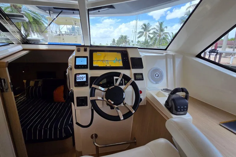 Slide: The Image of Cockpit of 2020 Aquila 44 Yacht with modern navigation equipment and luxurious interior. - 27