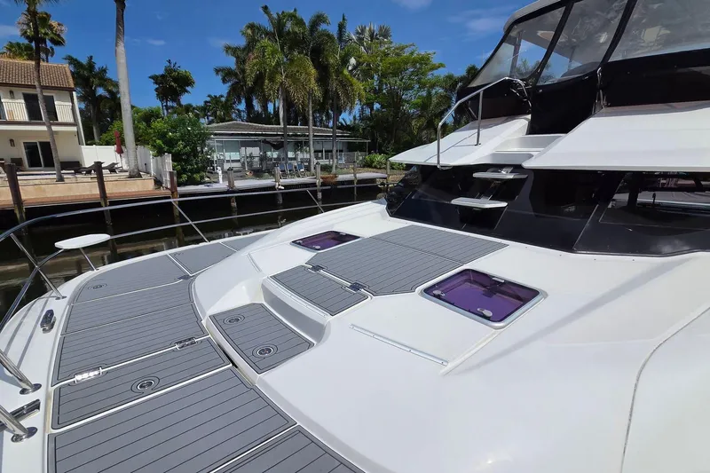 Slide: The Image of Aquila 44 Yacht 2020 model docked, featuring sleek deck design and modern amenities. - 29