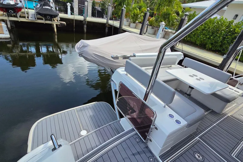 Slide: The Image of Aquila 44 Yacht 2020 model docked, featuring sleek seating and modern design. - 33