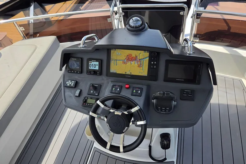 Slide: The Image of Cockpit of 2020 Aquila 44 Yacht featuring advanced navigation and control systems. - 36