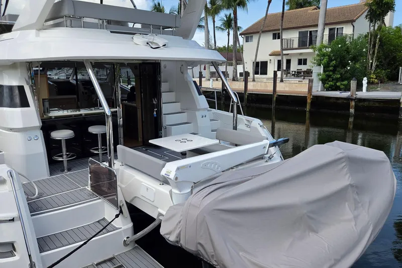 Slide: The Image of 2020 Aquila 44 Yacht docked, featuring a spacious deck and modern interior design. - 38