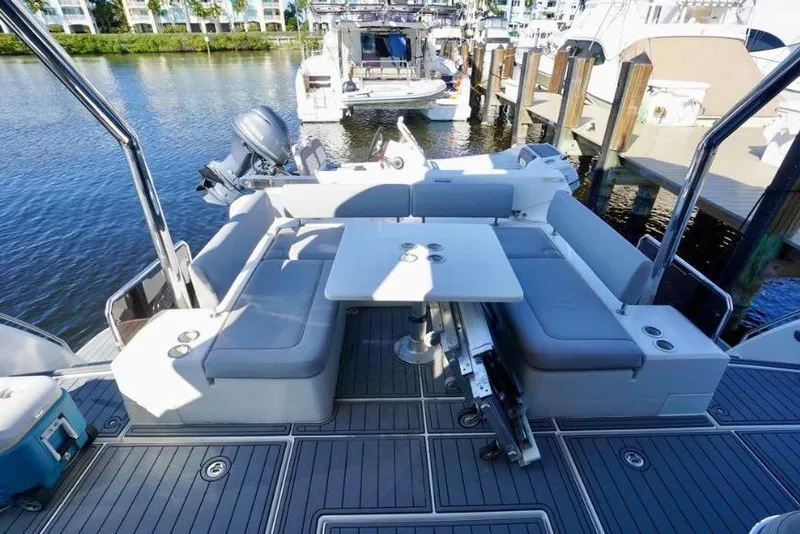 Slide: The Image of Aquila 44 Yacht 2020 with spacious seating and table on deck. - 39