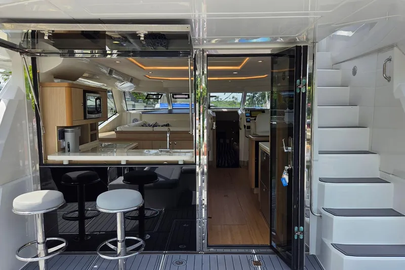 Slide: The Image of Interior view of 2020 Aquila 44 Yacht featuring modern kitchen and seating area. - 5