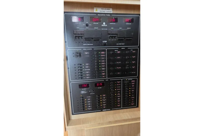Slide: The Image of Electrical control panel on a 2020 Aquila 44 Yacht, featuring various switches and indicators. - 50