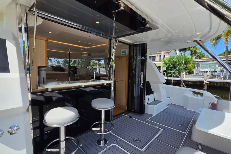Slide: The Image of 2020 Aquila 44 Yacht interior with modern seating and sleek design. - 6