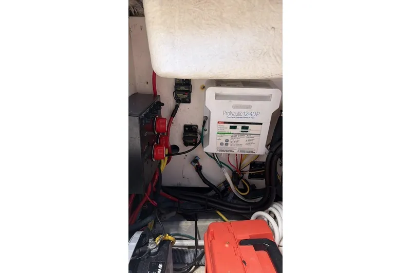 Slide: The Image of Electrical system inside a 2014 Robalo R265 Walkaround boat, featuring ProNautic charger. - 13
