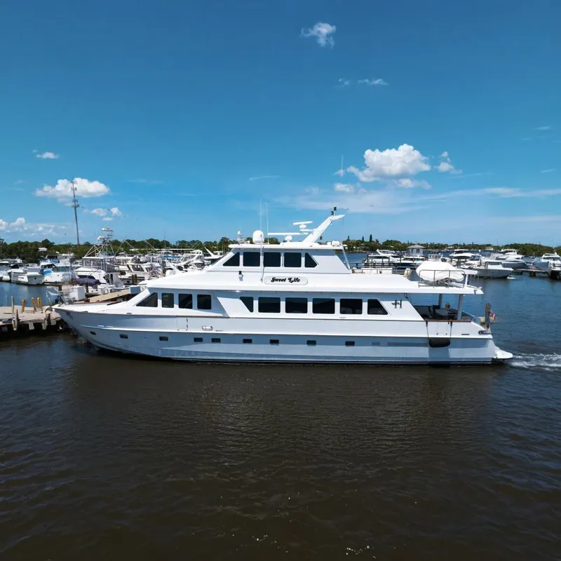 The Image of Luxury 2001 Hargrave 94 yacht docked in marina under clear blue sky. - 0