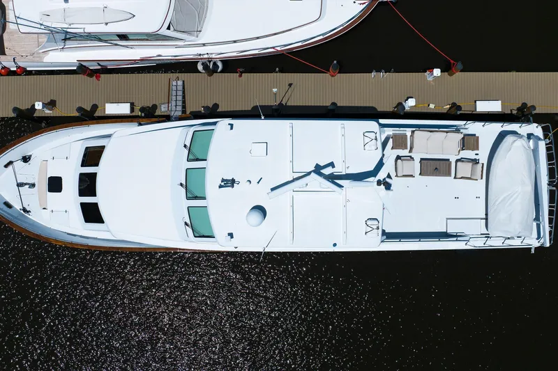 Slide: The Image of Aerial view of a 2001 Hargrave 94 yacht docked at a marina. - 103