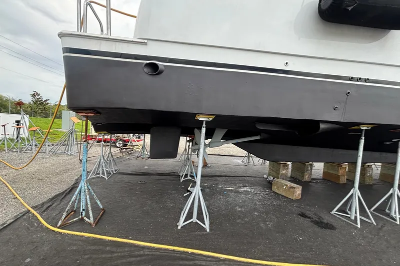 Slide: The Image of Hargrave 94 yacht from 2001 on stands for maintenance, showing hull and supports. - 112
